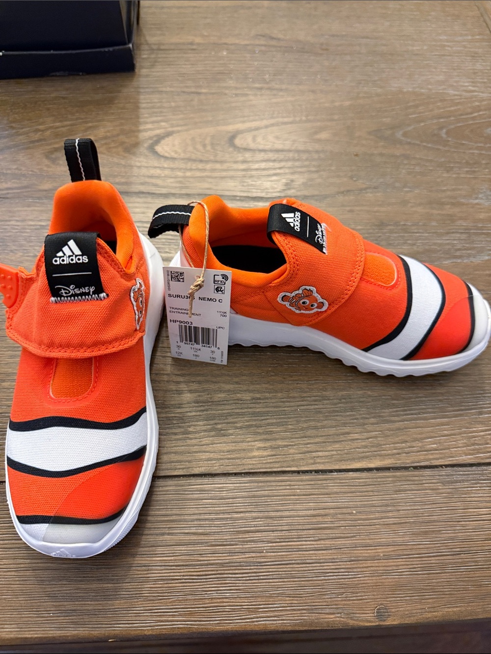 adidas Nemo size 12 Boys Orange and White Kids' Slip-On Sneakers